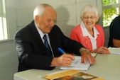 Lloyd Ball signs his book